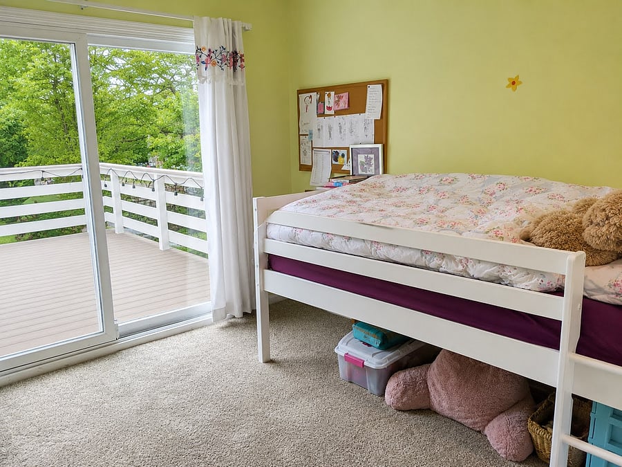 Bedroom 2 includes access to the deck. Will be furnished with a queen bed and dresser.