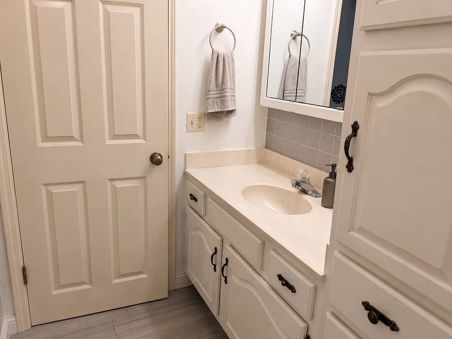 Upstairs bathroom has ample storage