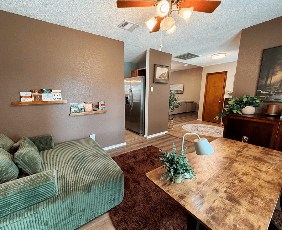 Office with view of living room and front entrance.