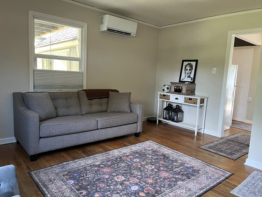 Living room with fireplace and record player.