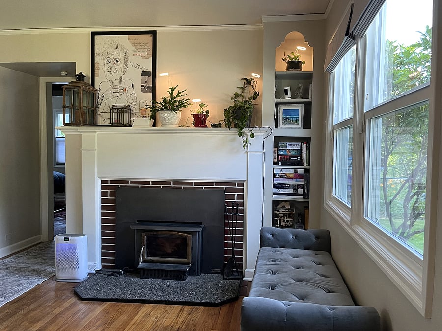 Living room with fireplace and record player.