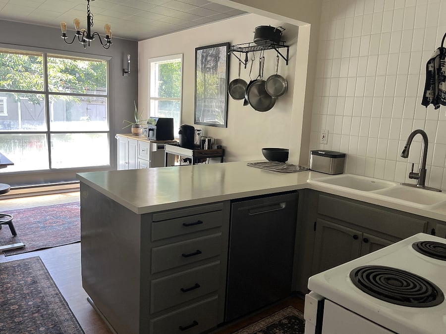 Kitchen plus workspace/dining.