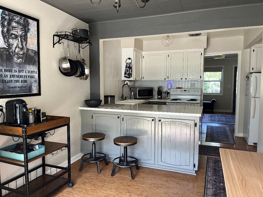Kitchen plus workspace/dining.