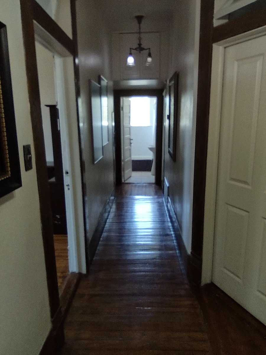 Bathroom is at the end of the hall. Robes are provided.