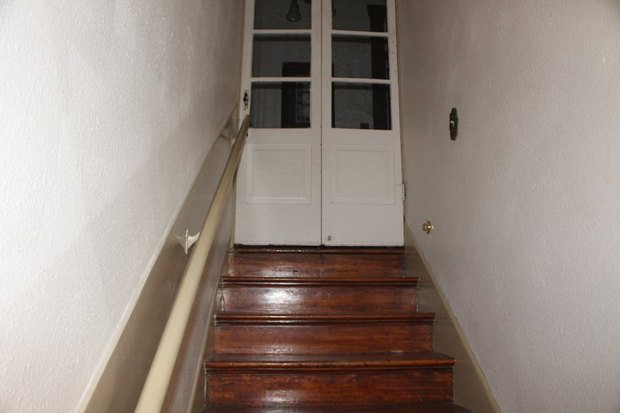 Doorway at the top of staircase. The Alarm is at the bottom of this staircase. 