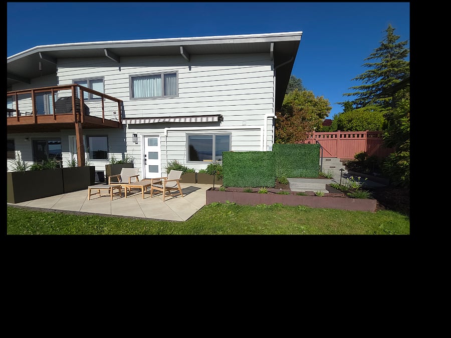 The ADU is the daylight basement to the main house (landlord on site). Awning and planters provide privacy for the ADU.