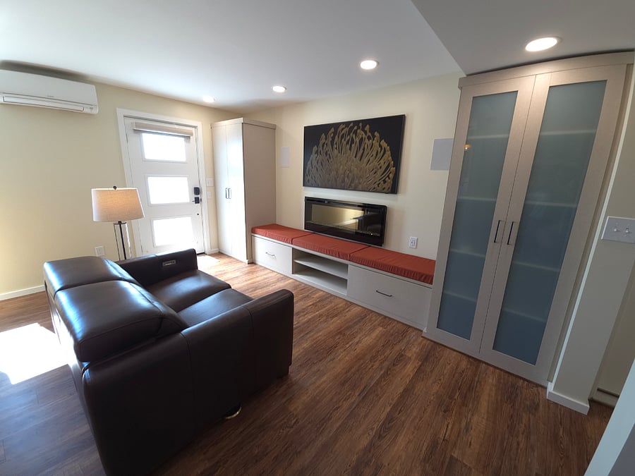 All-leather reclining loveseat has built in USB port. In-floor outlets eliminates need for long extension cords.Frosted glass door allows light and privacy.