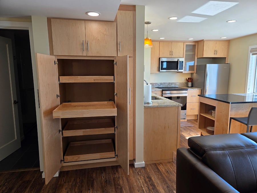 Lots of cabinets/storage, with pull out drawers and a pull-out pantry.