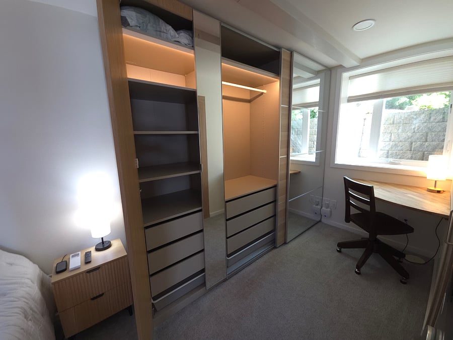 Extra large wardrobe closet provides shelves, drawers, space to hang shirts and and long dresses.