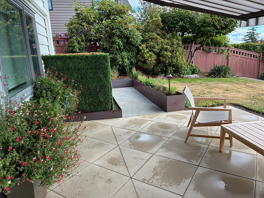 Planters line the back and north side of the patio.