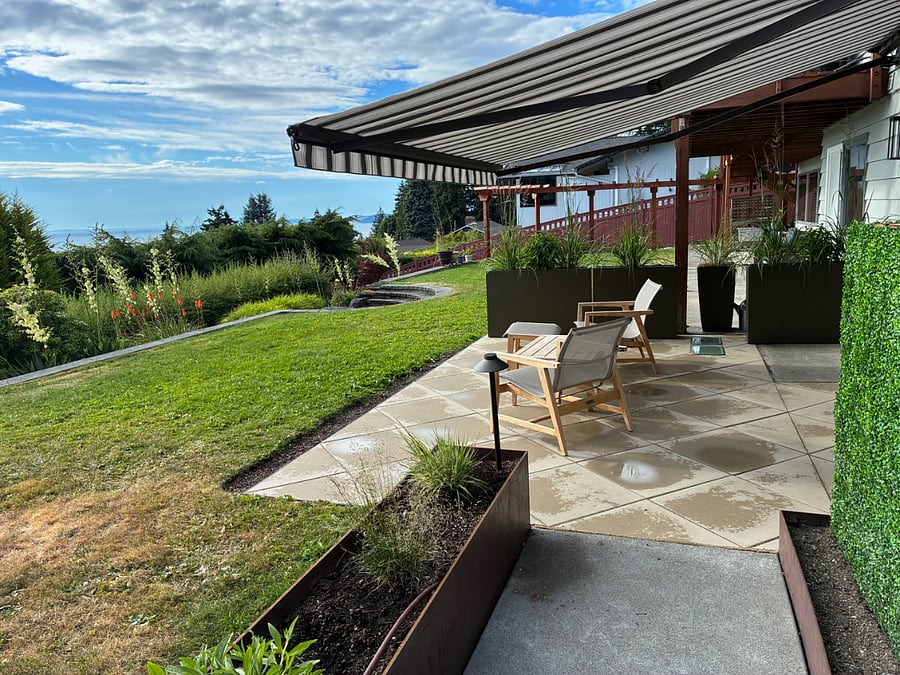 Retractable awning provides privacy and frames a tranquil space.