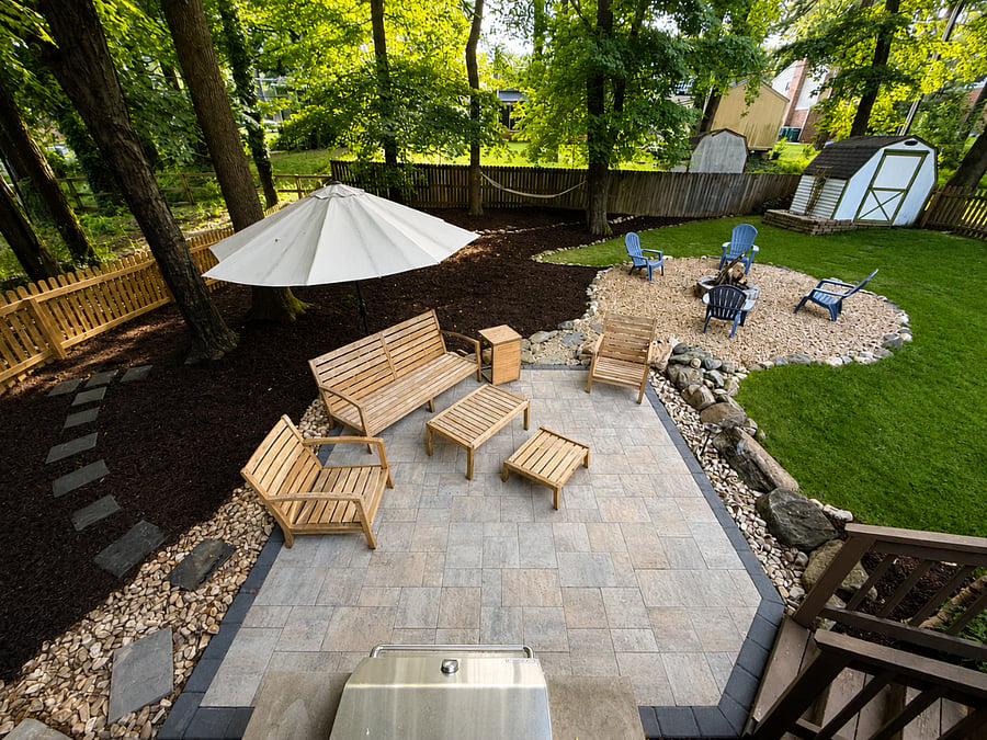 Back yard with back deck, grill, blackstone, fire pit, full tool shed, and lounging