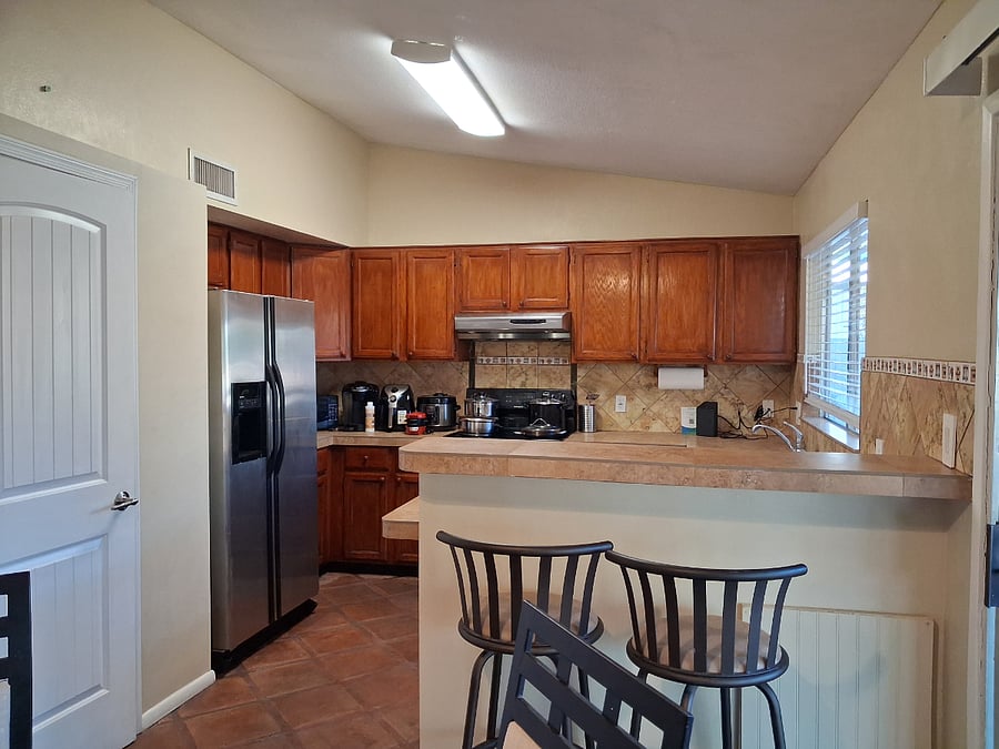 Kitchen with fridge, stove, dishwasher, microwaveairfryer, coffee maker, rice cooker, breakfast sandwich maker