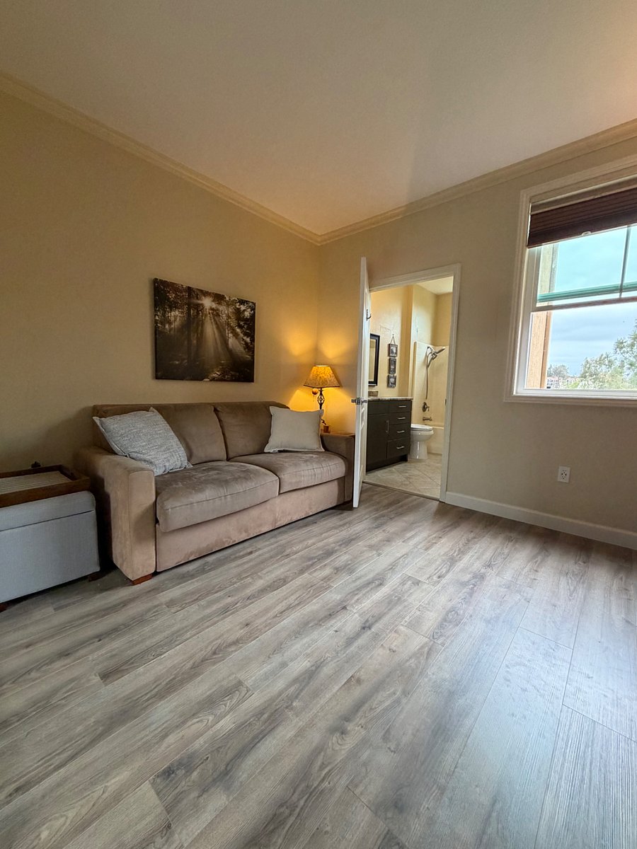Flexible second suite with queen sleeper sofa and private attached bathroom.