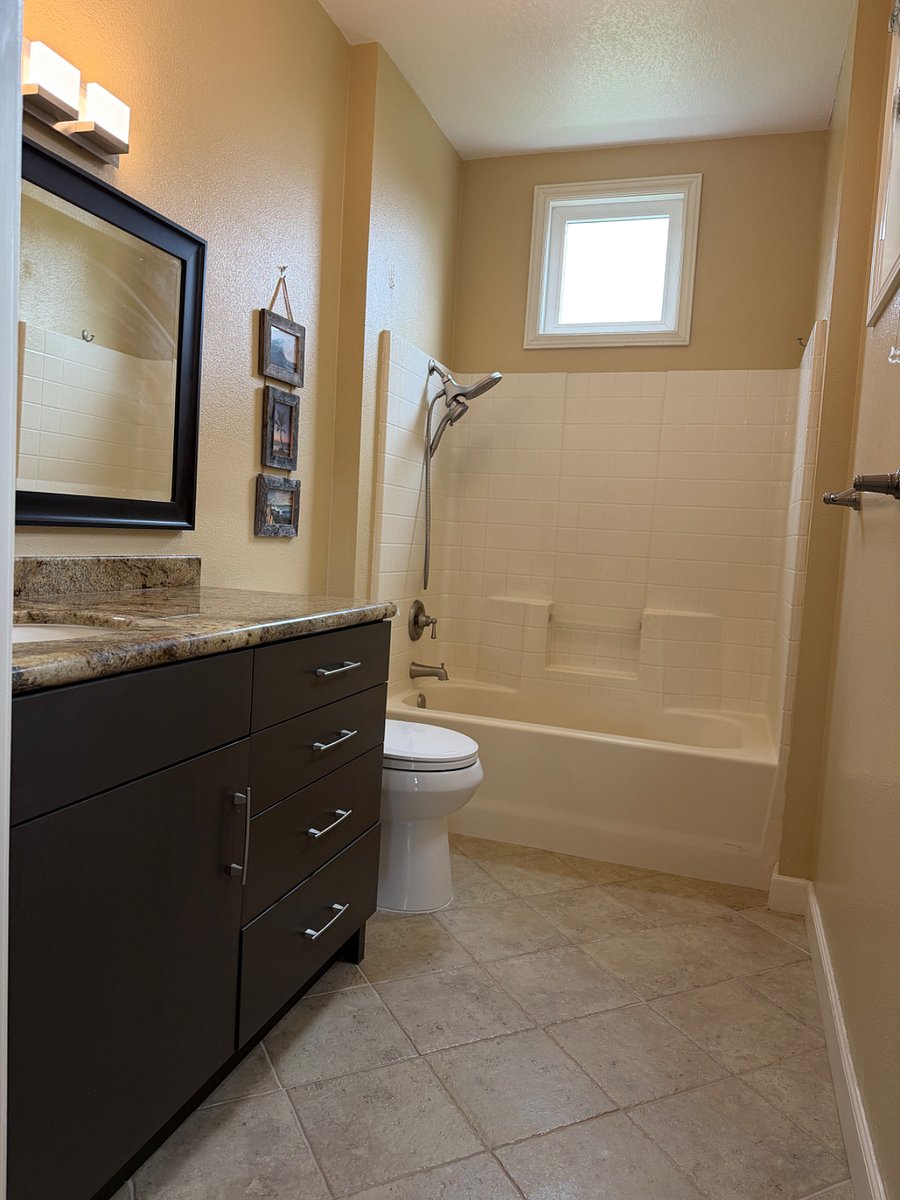 Private secondary bathroom with tub-and-shower combination.