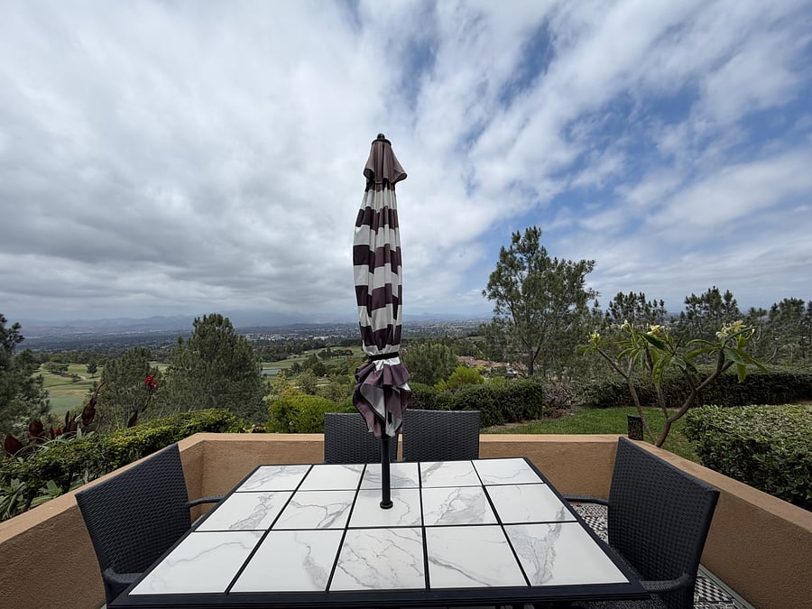 Private patio dining with expansive golf-course, valley, and mountain views