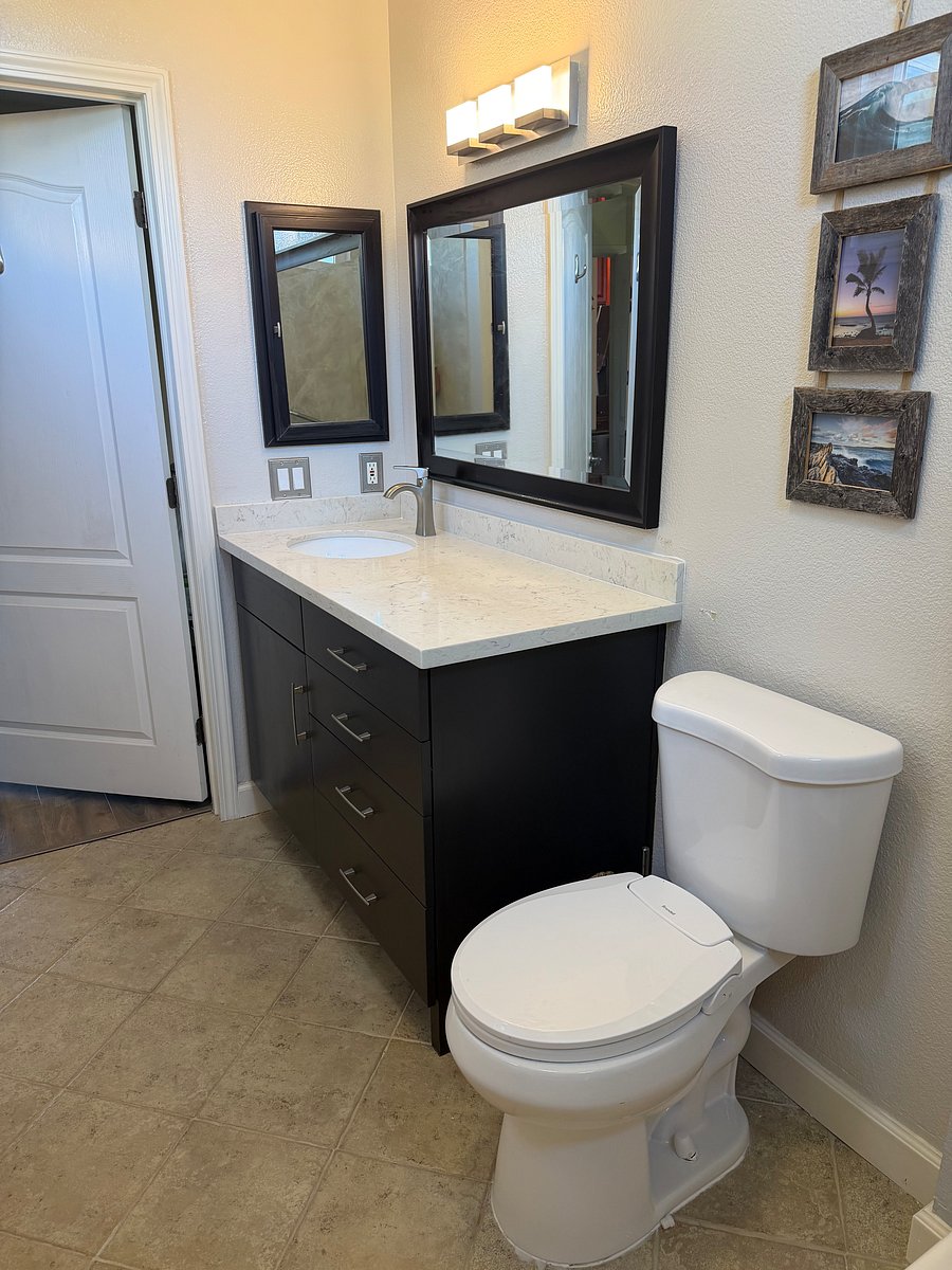 Newly remodeled private bath with a new shower and granite countertop
