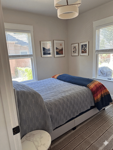 Main floor Primary Bedroom. Queen Bed, dresser.