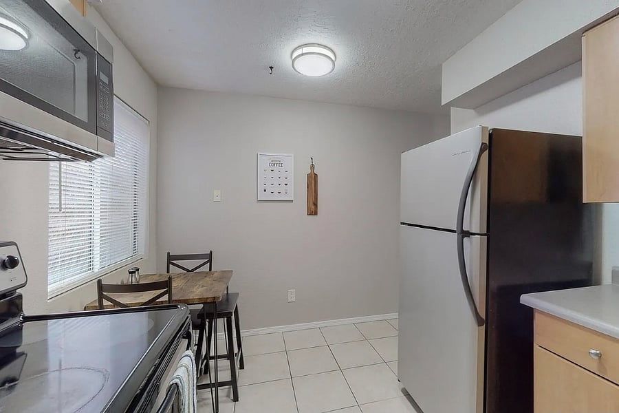 full kitchen with dining table