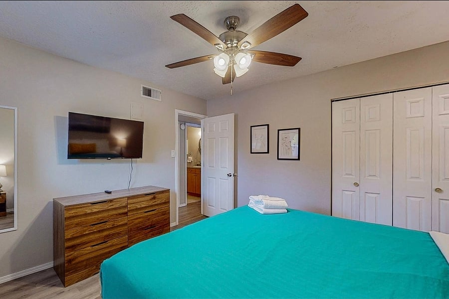 king bed, dresser, smart tv