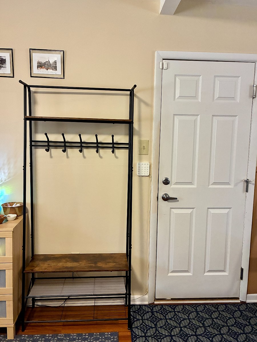 A clothing/shoe rack for you by the garage door. Remove shoes upon entering.