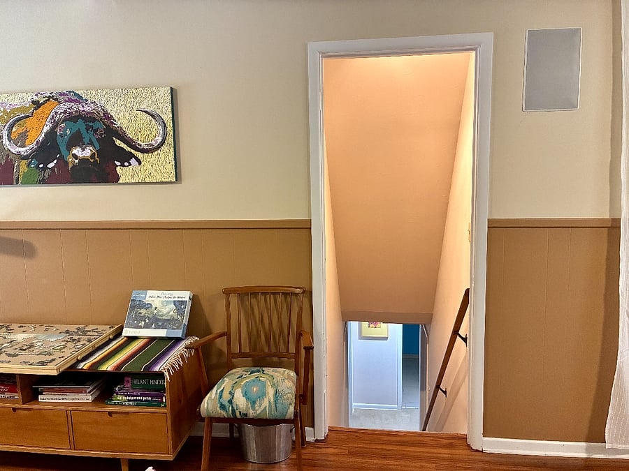 View as you come in to den from the garage - a straight path towards stairs to access your space.