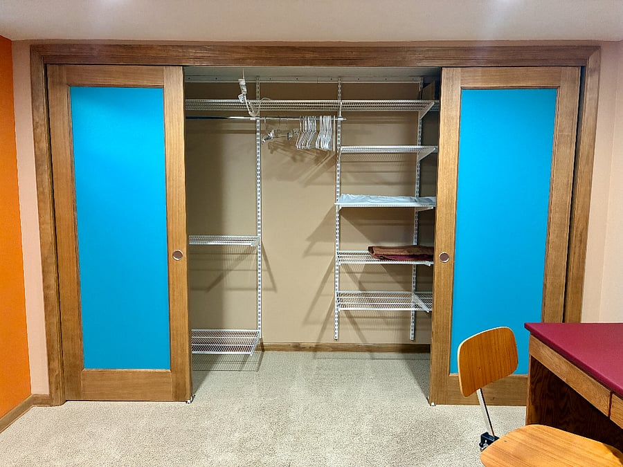 Large closet in the multi-purpose room, with storage components.