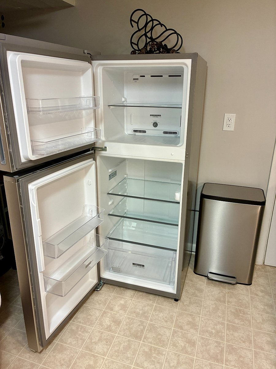 Fridge and freezer, large step trash can.