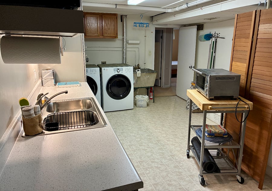 View from far side of dedicated kitchenette. In-unit laundry. I use it on weekends, and will coordinate on timing.
