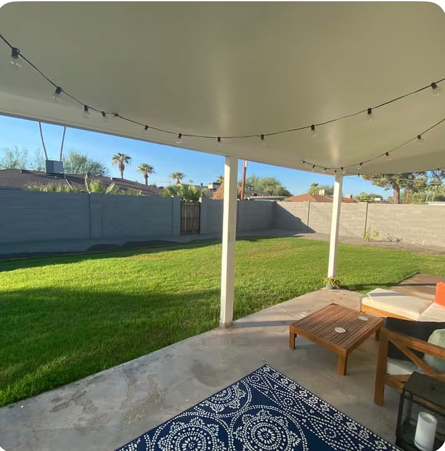 Access the fully fenced backyard through french doors