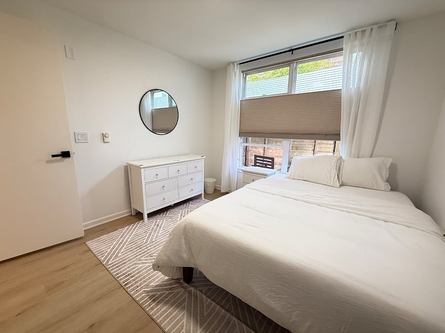 Secondary bedroom; windows open up to enclosed patio
