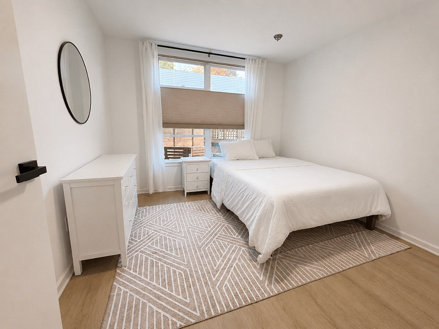 Secondary bedroom; windows open up to enclosed patio