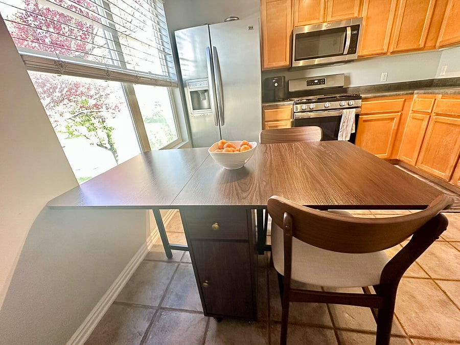 Kitchen table easily converts from 2 to 4 seats.