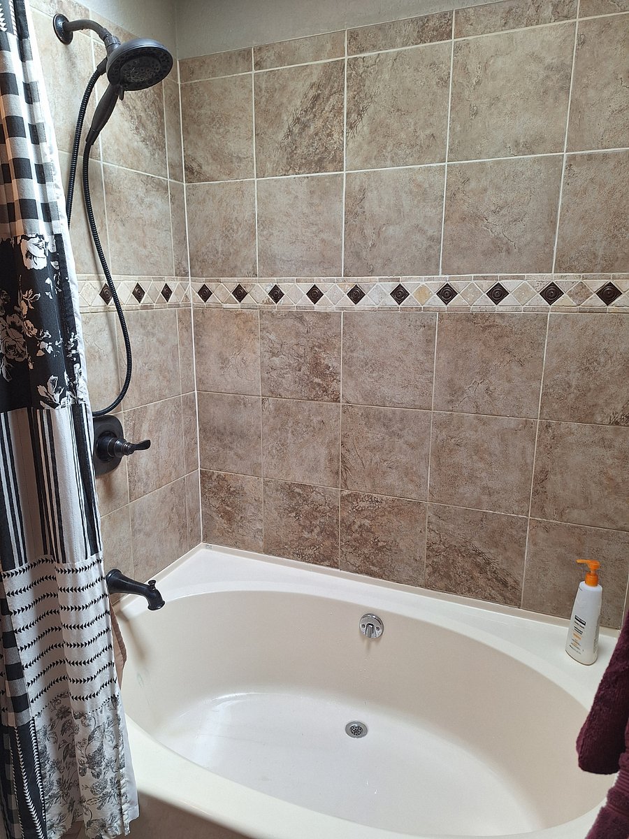Hall bath with seats in shower