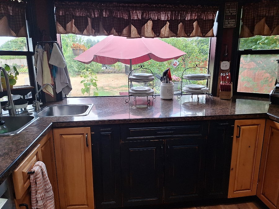 sink and bay window, big cutting board in drawer