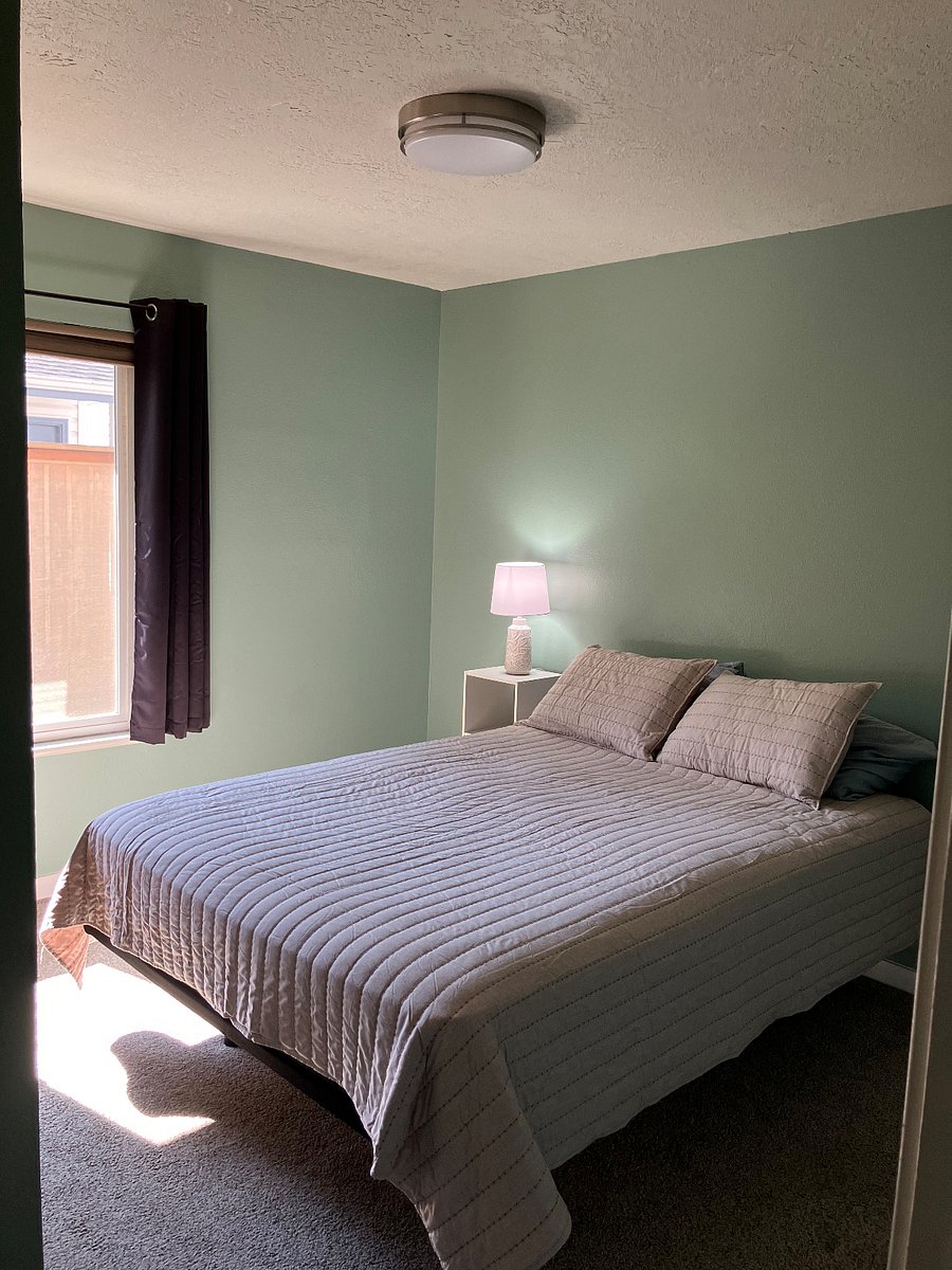 Queen size bed, sun filtering blind and blackout curtains