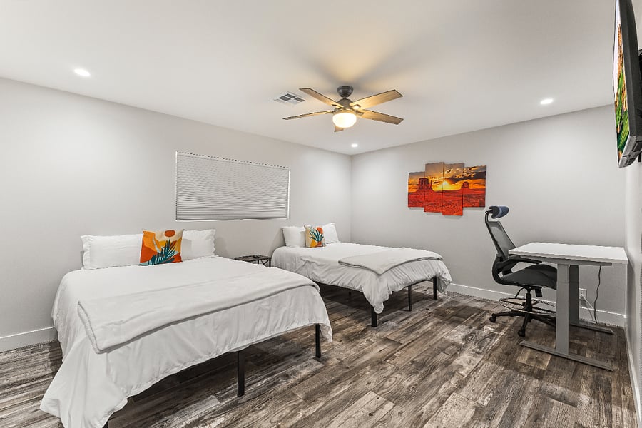 Bedroom 2. Two Queen beds, office powered sit/stand desk