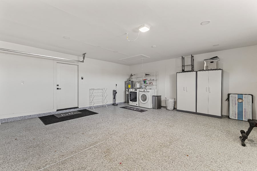 2 car attached garage with Washer and Dryer, storage and racks for towels