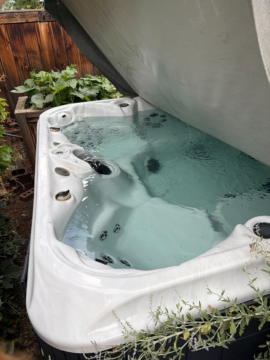 Private hot tub in backyard
