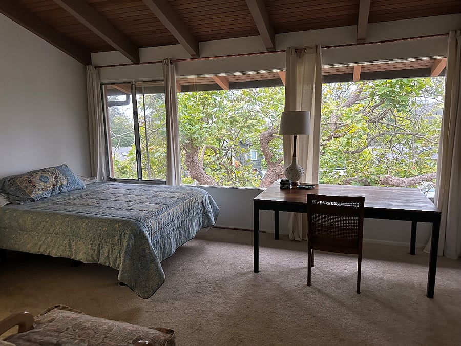 bedroom one - vaulted redwood ceilings - front of house
