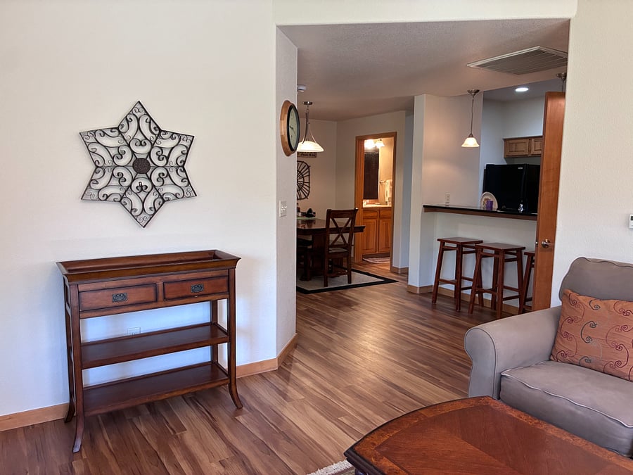 Leaving living room to enter dining, kitchen and guest bath.