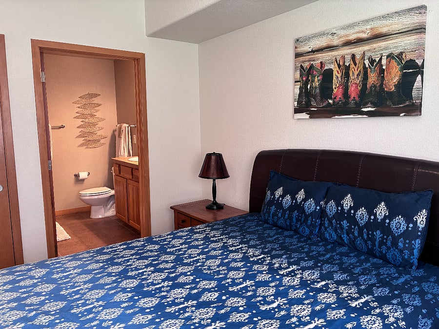 Master bedroom leads to full-size master bath with tub and shower. Vanity has numerous drawers and medicine cabinet.