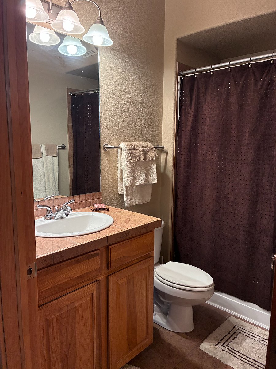 Second bathroom also has a full-sized tub and shower.