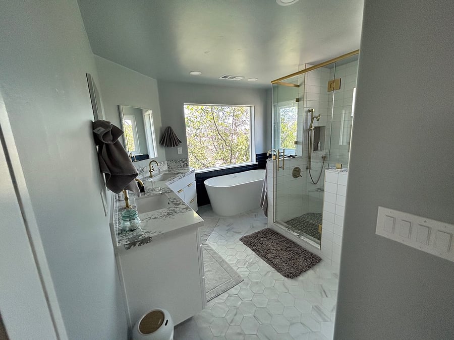Primary bath with soaking tub, shower, dual sinks and views!