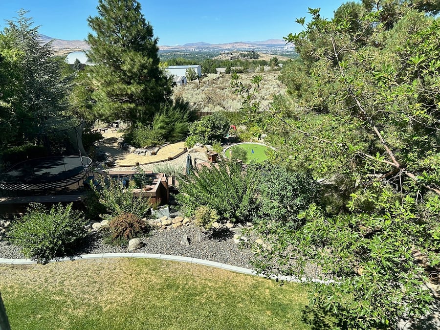 Large private backyard with wine walk and putting green.