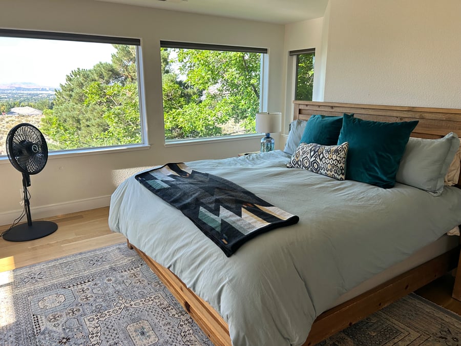 Second floor primary with king bed and spectacular views.