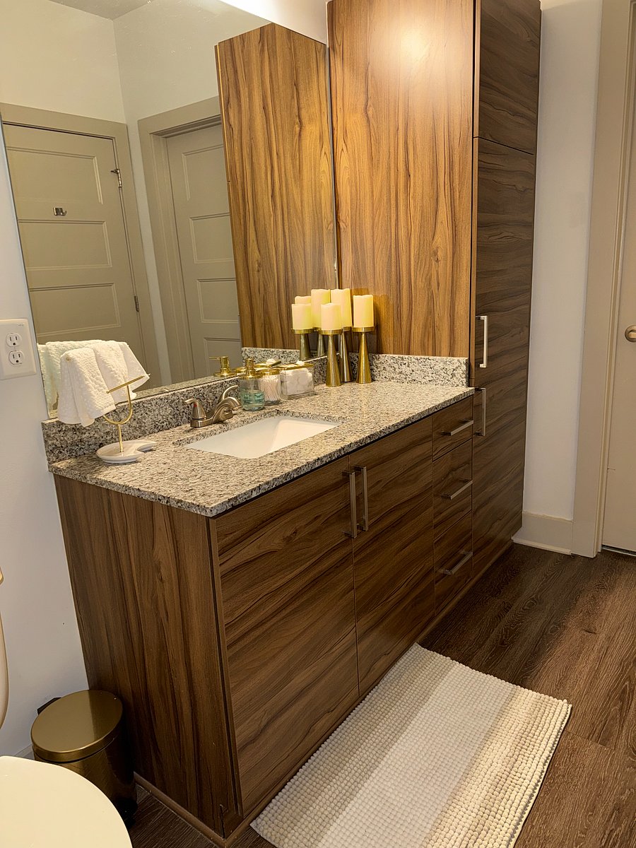 Bathroom 1 with Woodgrain Linen cabinets