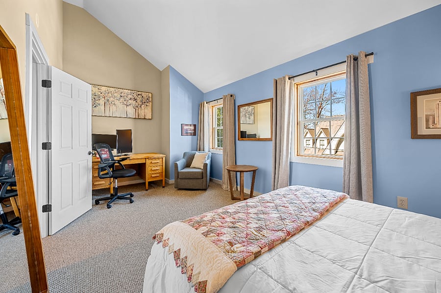 Bedroom 1 is spacious with working area and lake views