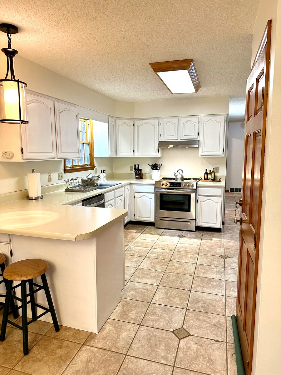 Fully equipped Kitchen with cookware, dinner ware, utensils, coffee maker, toaster, microwave, full size SS refrigerator, dishwasher, and electric stove and oven.