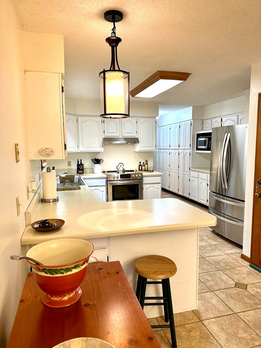 Fully equipped Kitchen with cookware, dinner ware, utensils, coffee maker, toaster, microwave, full size SS refrigerator, dishwasher, and electric stove and oven.